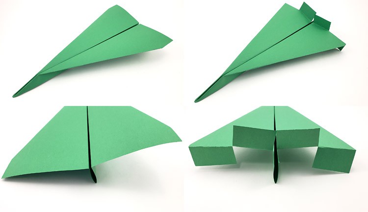 Two paper planes with one plane having flaps added to the back of the wings