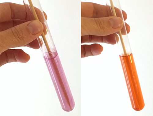 Two photos of a test tube filled with a purple liquid on the left and orange liquid on the right