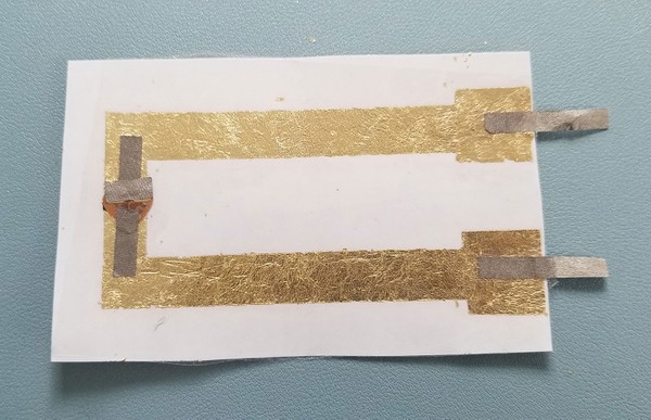 Adhesive film covering circuit 