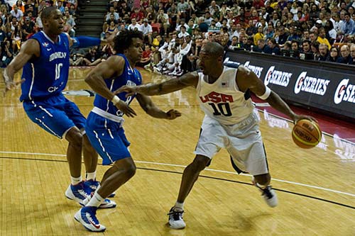 Photo of Kobe Bryant dribbling a basketball during a game
