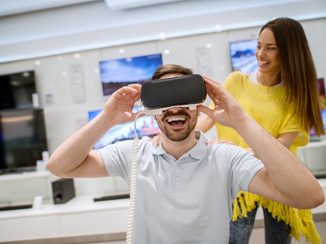 Person trying out virtual reality headset