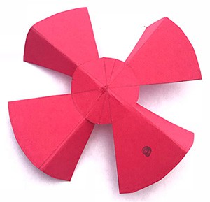 A propeller with four blades is cut from a piece of paper