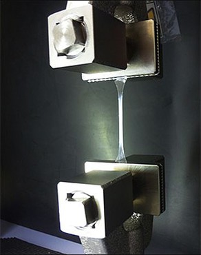 The left image shows how a machine stretches a polymer strand.
