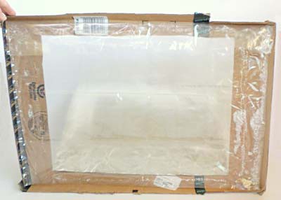 An oven bag is glued to the underside of a cardboard lid