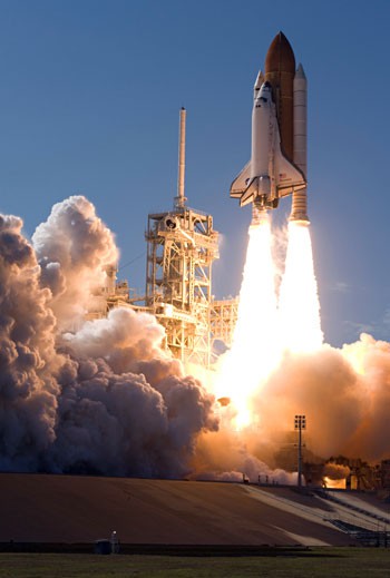 Photo of a rocket and spaceshuttle during takeoff