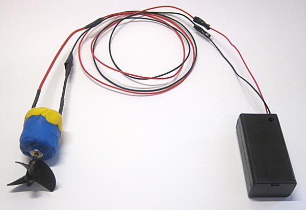 A battery pack connected to a water-proofed DC motor with a propeller attached