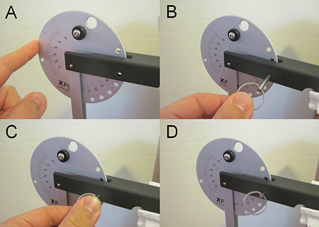 Four photos of a pin securing the disk of a catapult arm to the catapult base