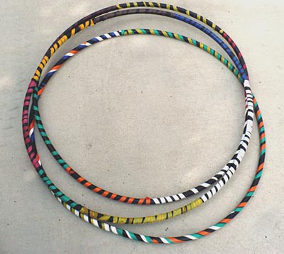 Three hula-hoops wrapped with colorful tape