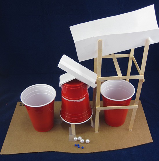Marble sorting machine made from paper, popsicle sticks and plastic cups