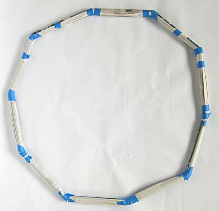 Newspaper tubes taped together to form a circle
