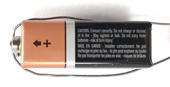 Wire wraps around the length of a 9 volt battery
