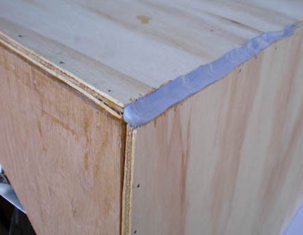 Polyurethane sealant is used to seal the corners and edges of a wooden box
