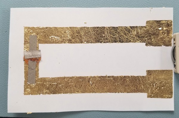 The front of the metal leaf circuit, vinyl, and temporary tattoo backing. 