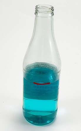 bottle half full of colored water