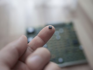 Man holding microchip