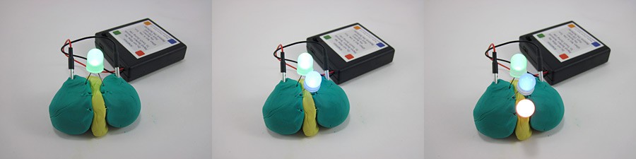 Three photos of one, two and three LEDs lit in parallel using conductive play dough and a battery pack