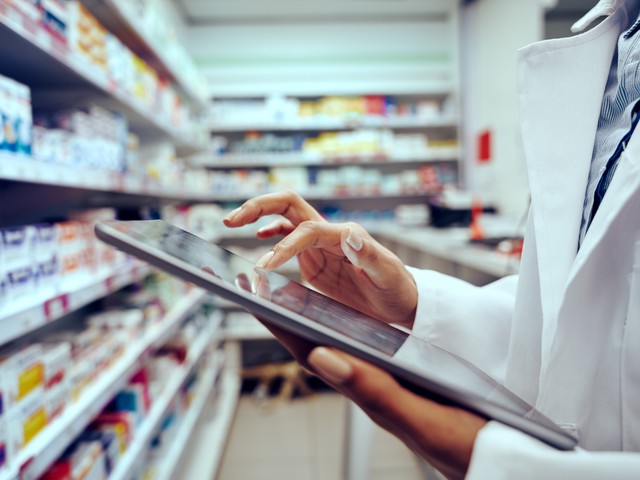 pharmacist organizing medications taking inventory