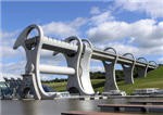 The Falkirk Wheel is a large rotating boat lift that can spin quickly due to precise weight balancing of its two sides