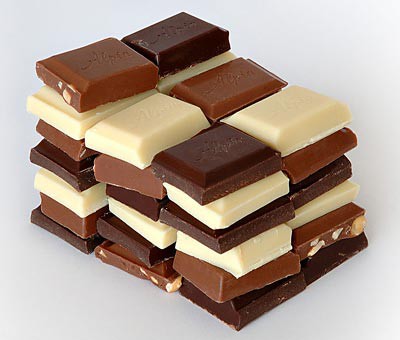 Squares of different chocolates stacked together