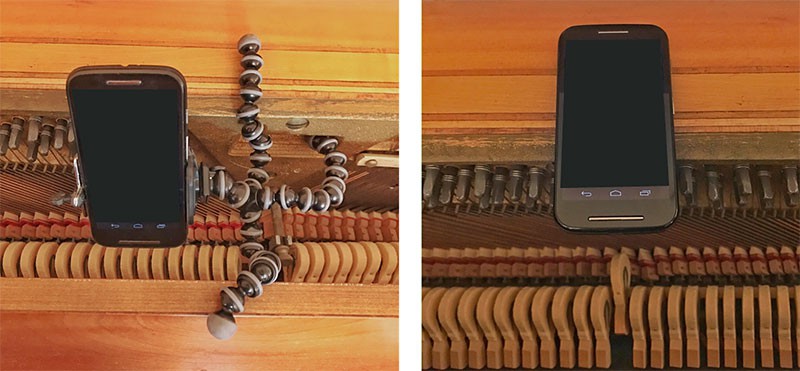 Smartphone is placed above the hammers within a piano