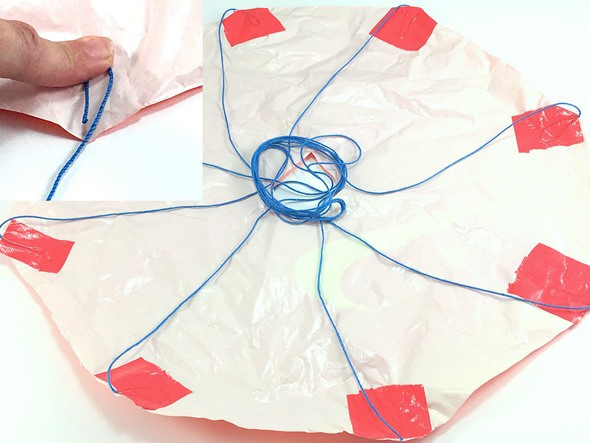 Illustration of how to tape the suspension lines to the corners of the canopy.