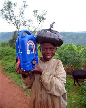A young boy holds a blue crank radio