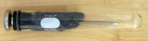 The probe thermometer and soaked steel wool incased within a test tube
