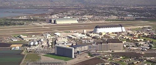 Aerial photo of a long building owned by NASA that contains a wind tunnel