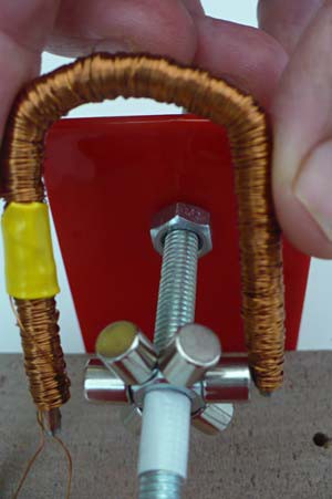 Six magnets on a hex nut fit between two prongs of a wire wrapped iron core that has been bent into a U shape
