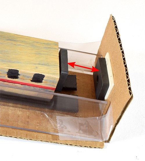 The distance between the magnet on the back of the maglev train and the stopper magnet on the end of a track is measured