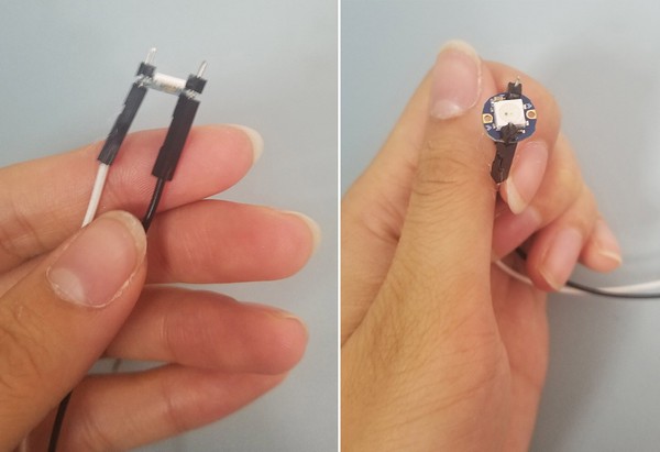 Jumper wires are capped by black plastic pieces from male header pins.  Birds-eye-view of capped jumper wires. 