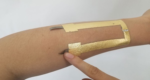 Removing conductive fabric tape backing. 