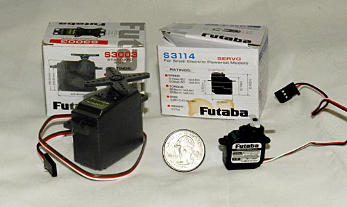 A large servo motor on the left next to a quarter-sized servo motor on the right