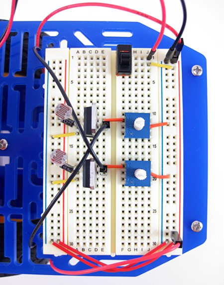 A fully wired breadboard for a light-following robot