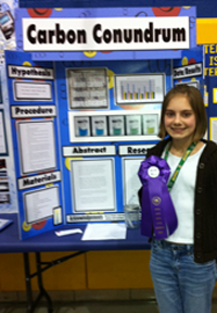 Student with science project display board