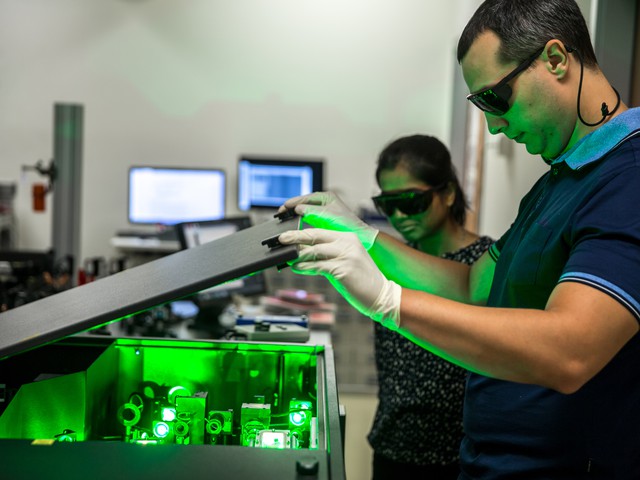 Engineer working with lasers