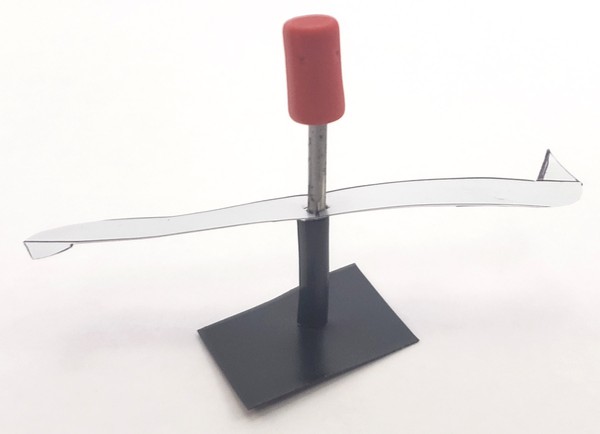 Aluminum rotor on nail shaft with pencil eraser on top 