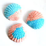 Shell-shaped bath bombs similar to the ones kids can make with the bath bomb science kit