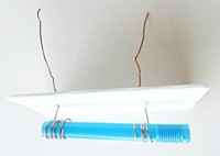 A conductivity sensor made from two strands of copper wire wrapped around opposite ends of a plastic straw