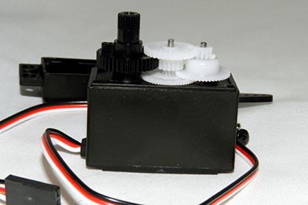 Plastic gears on a servo motor transfer energy from the motor to a shaft