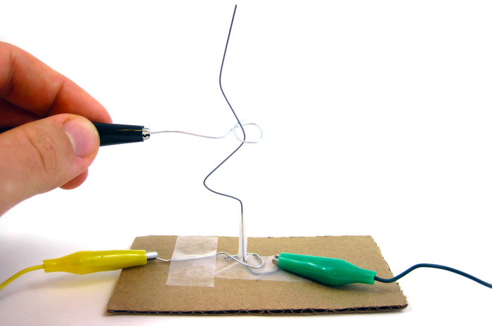 Carnival-style game made from a wire and coded so that it buzzes if you touch the wire