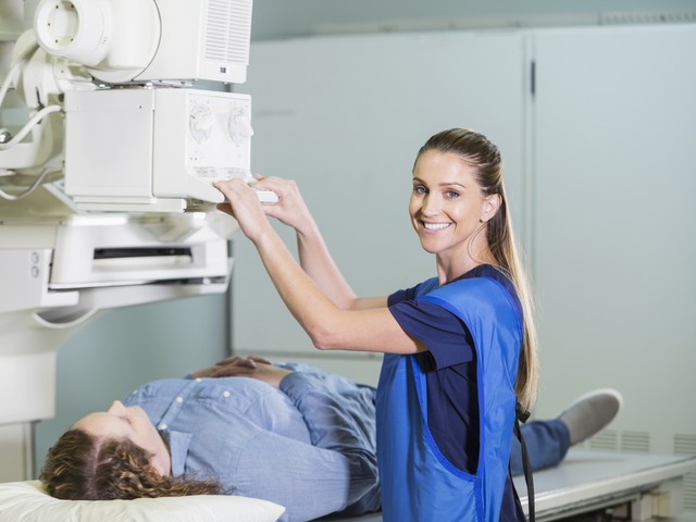 technician preparing xray for paitient