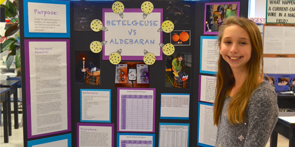 Ashleigh with her 6th grade science fair project display board