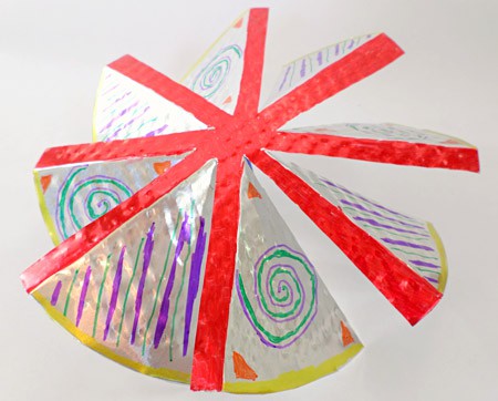 The blades of an aluminum windmill are decorated with markers