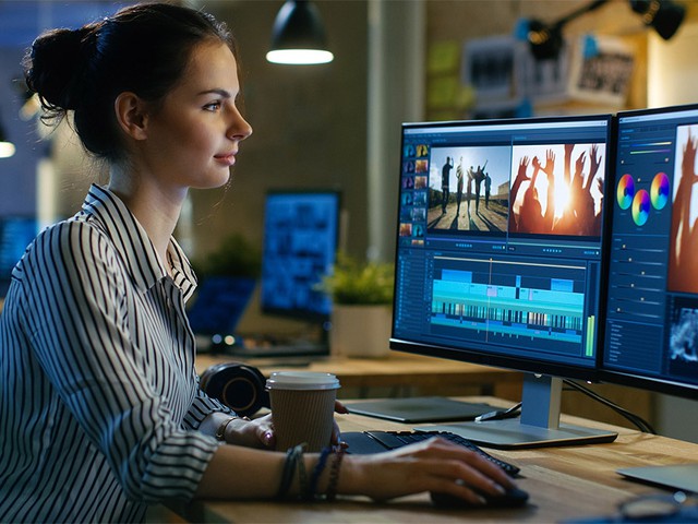 video editor working on computer