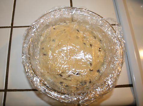 Cookie dough in a bowl sealed with plastic wrap