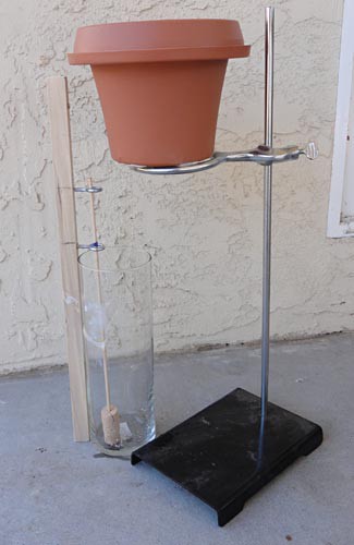 A flower pot suspended above a beaker