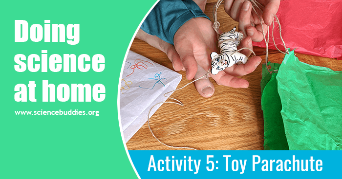 Student with homemade parachute and a toy figurine being used for a science activity