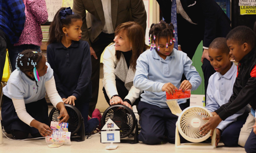 Mary Barra, GM Senior Vice President with students from Bates Academy