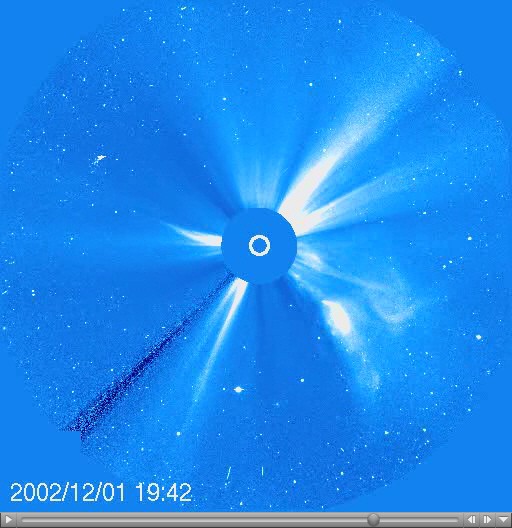 A coronagraph shows a large white flare emerging from the surface of the Sun with a timestamp of 2002/12/01 19:42
